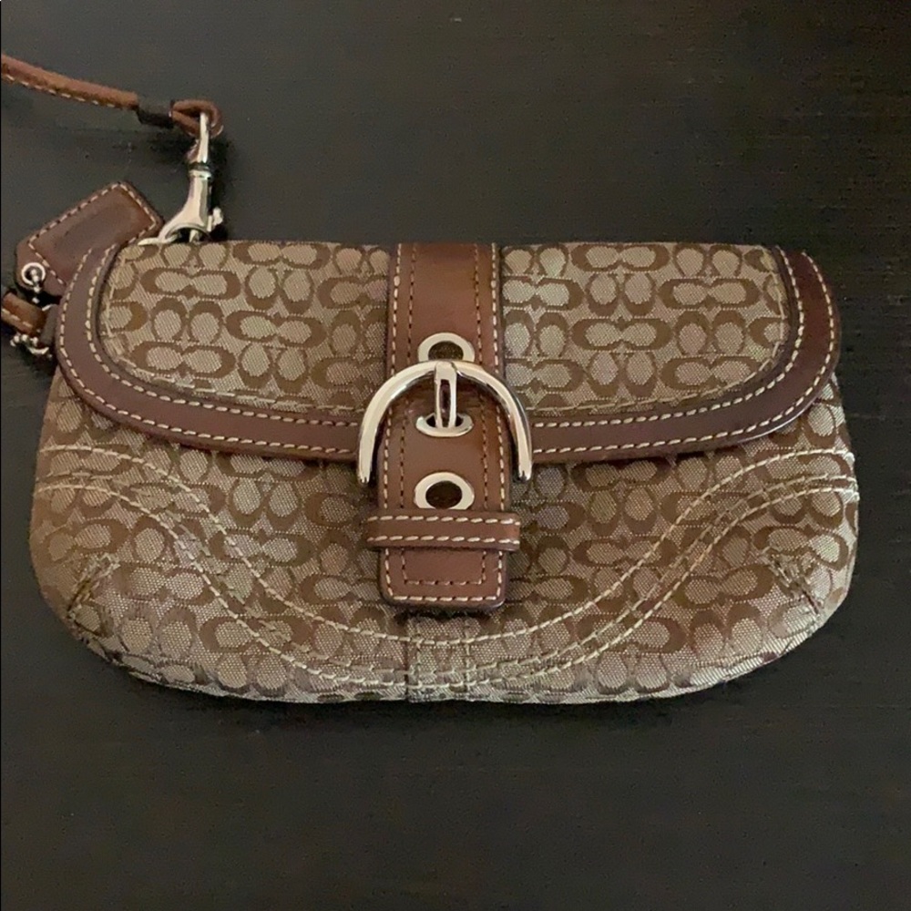 Tan and brown Coach wristlet.